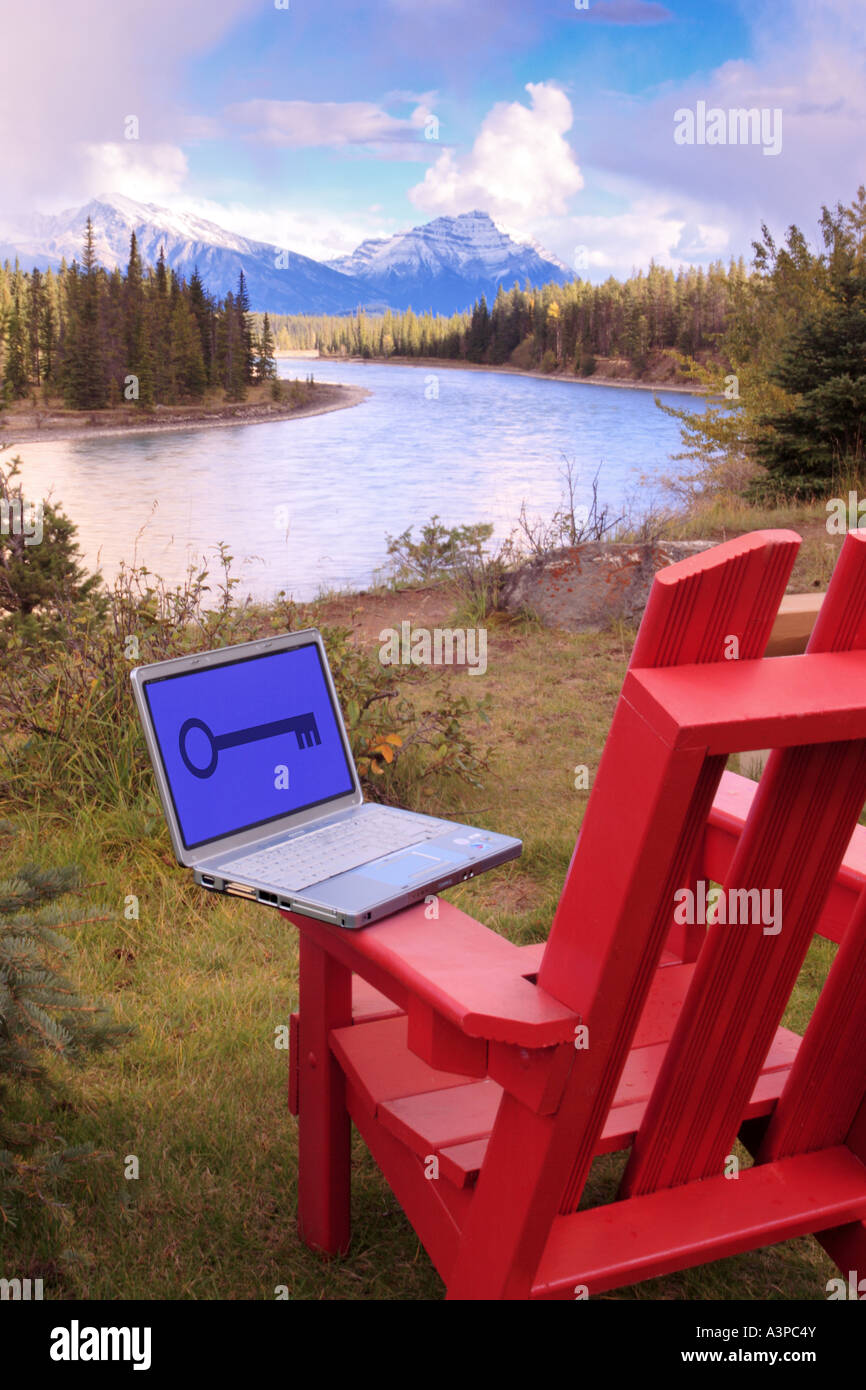 Laptop computer on deck chair in Jasper National Park Alberta Canada ...