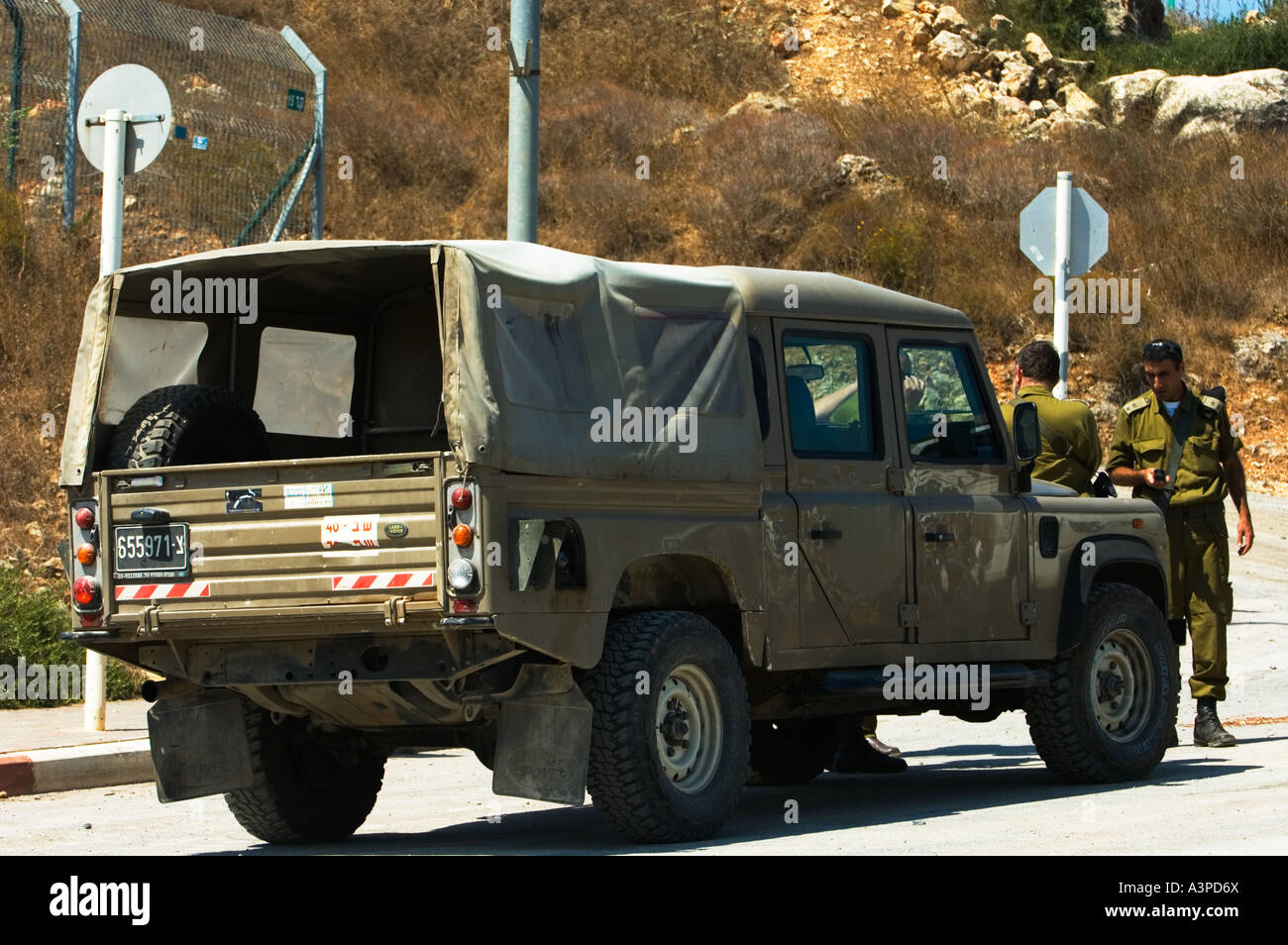 Military Hi cap Land rover crew cab Stock Photo