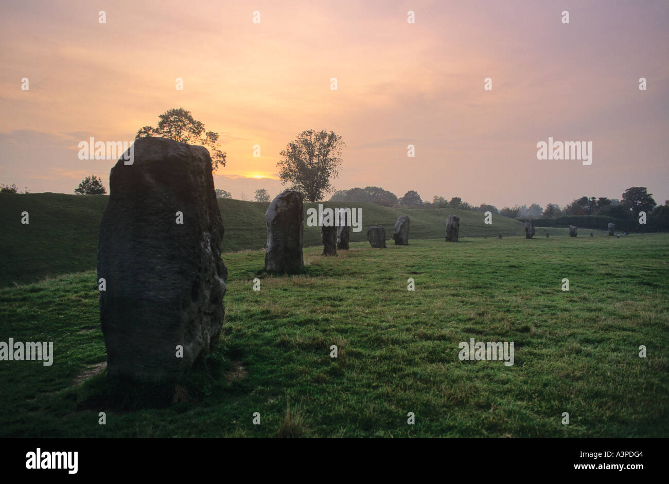 Stone circle surrounded by earthworks in the Wiltshire village of Avebury Wiltshire England Stock Photo