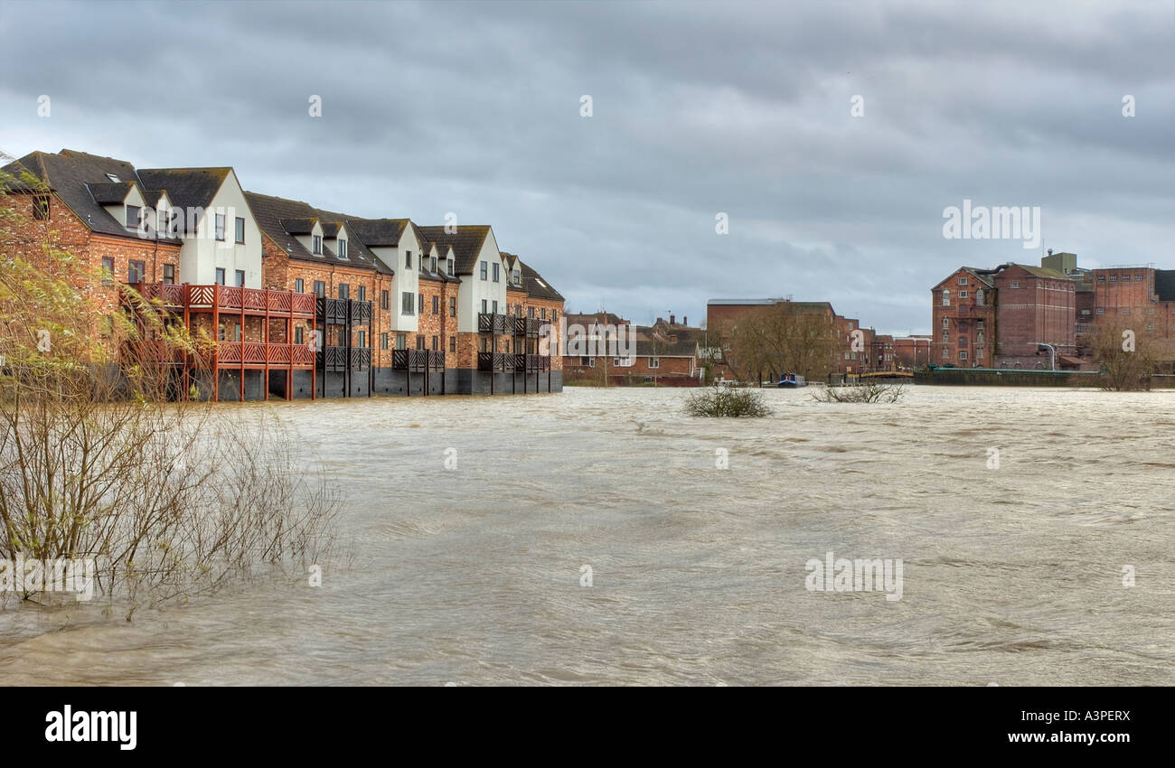 River Severn breaks its banks at Tewkesbury New homes build above flood waters Stock Photo