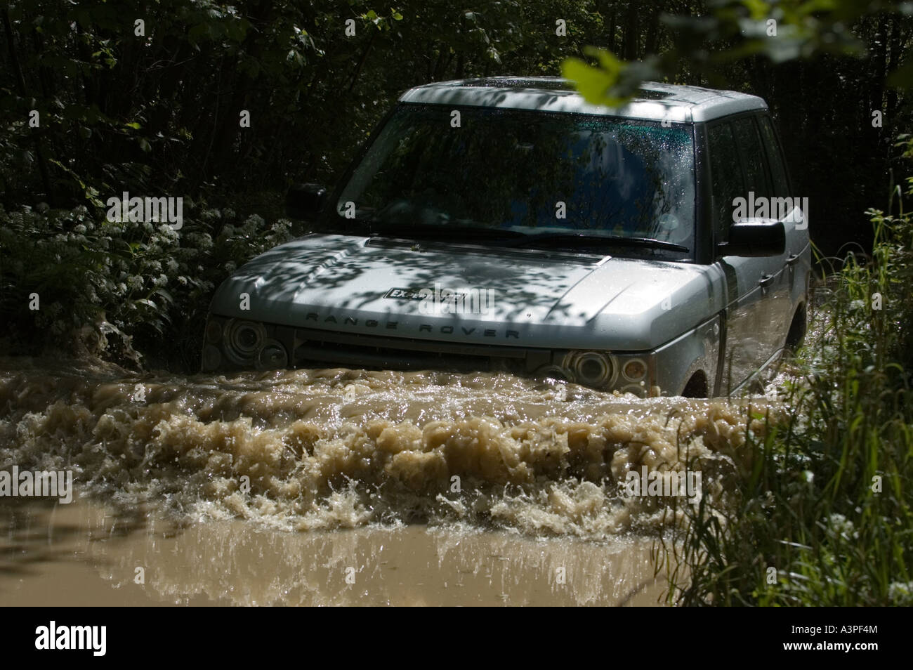 Land rover's flagship model the Range rover series 3 wades into deep water Stock Photo