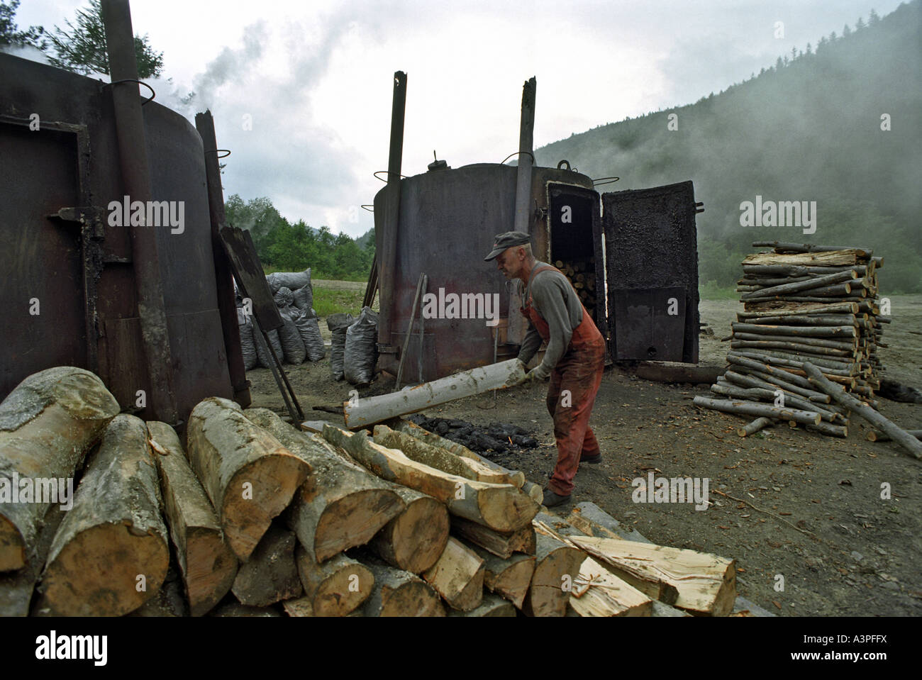 Charcoal burner working on the production of charcoal in the Bieszczady