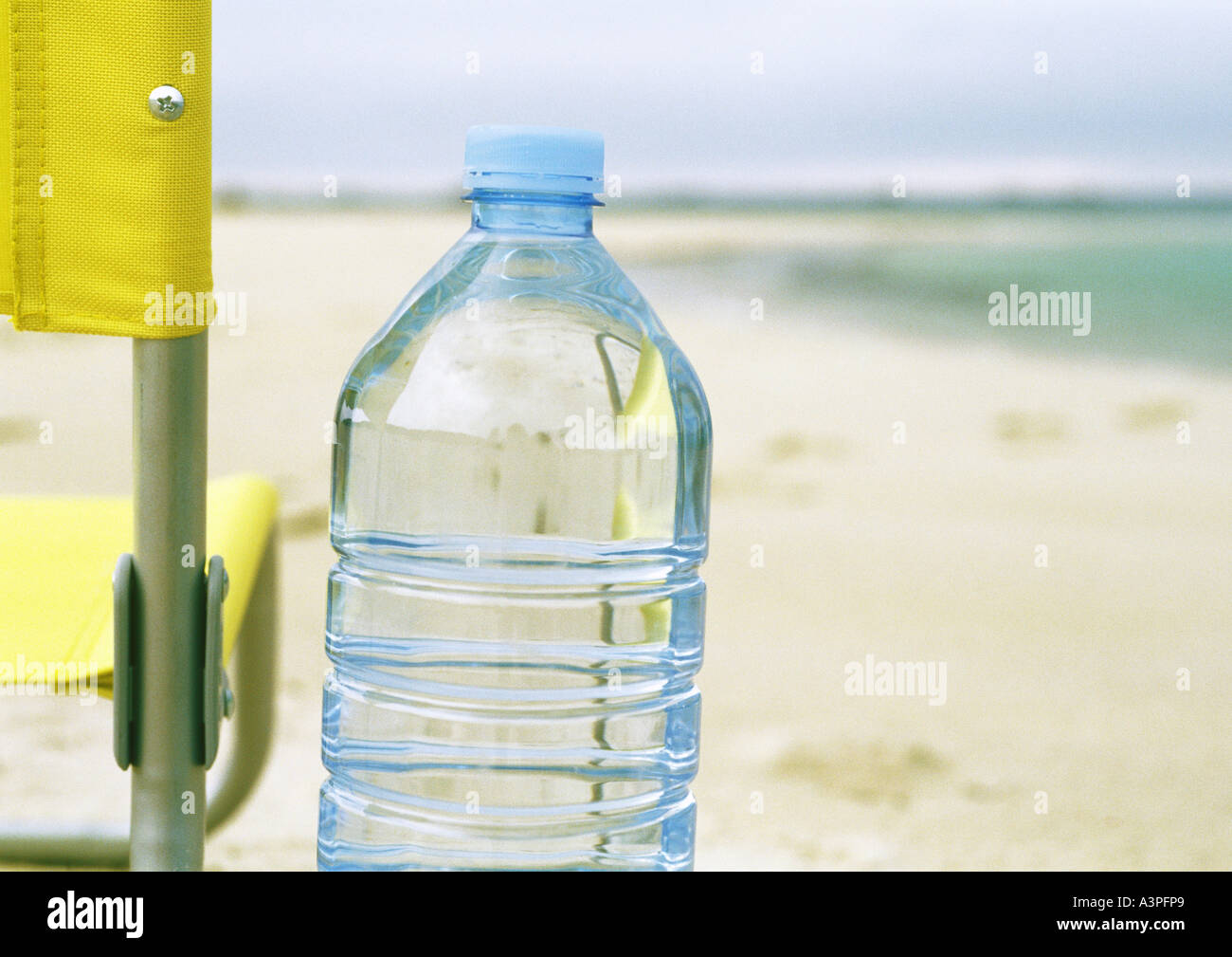 Bottle of water on beach Stock Photo
