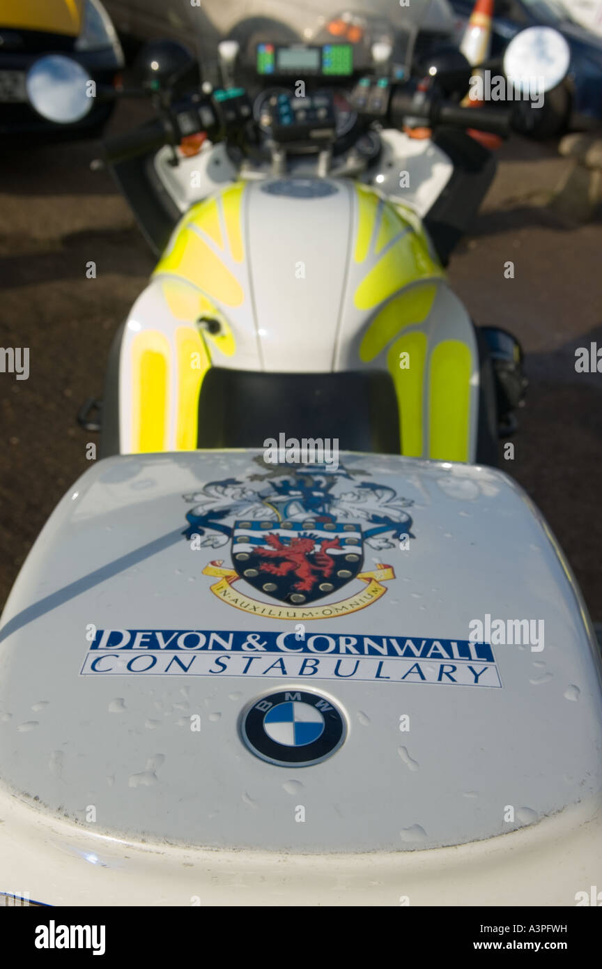 rear view of aDevon and Cornwall police motorbike featuring the coat of arms on the rear pannier Stock Photo