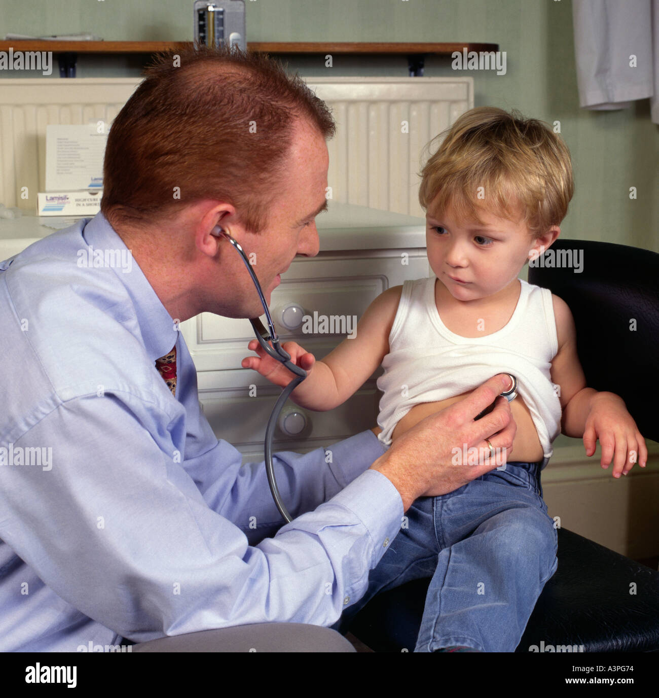 Doctor using stethoscope on a child Stock Photo Alamy