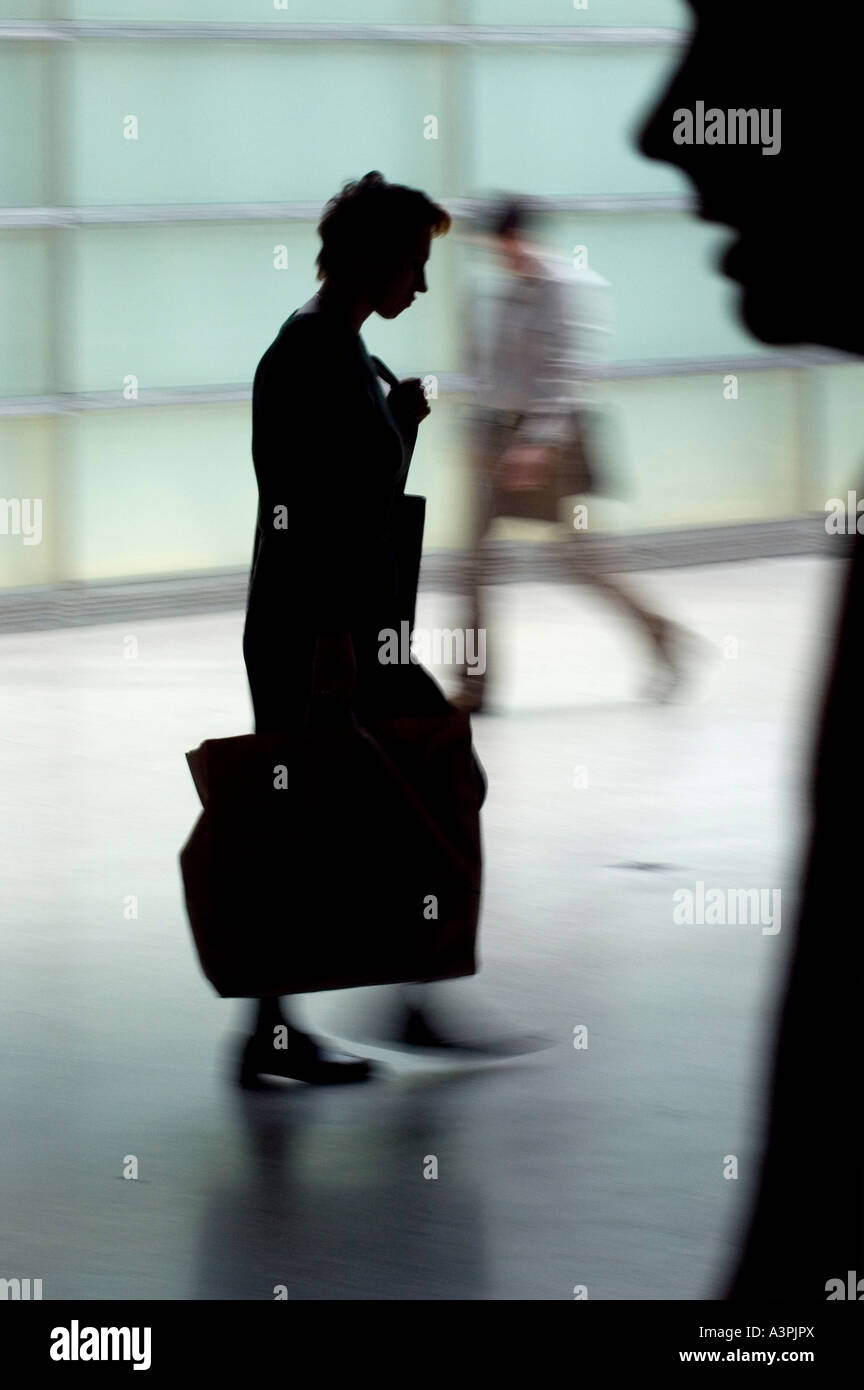 Silhouettes of walking people Stock Photo
