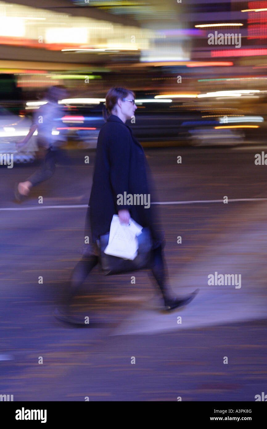 Woman crossing a street Stock Photo - Alamy