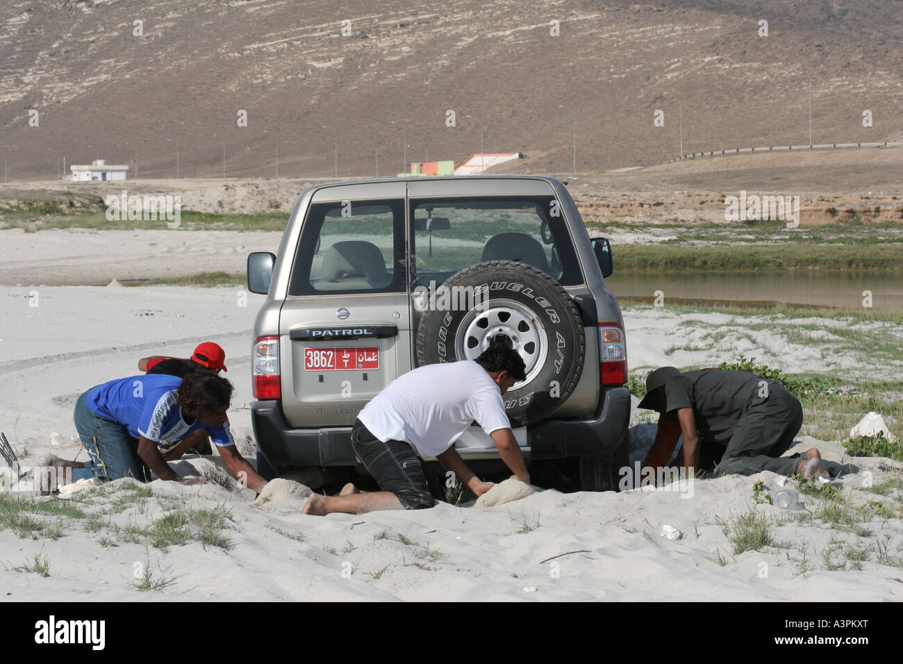 Car stuck in sand Stock Photo Alamy