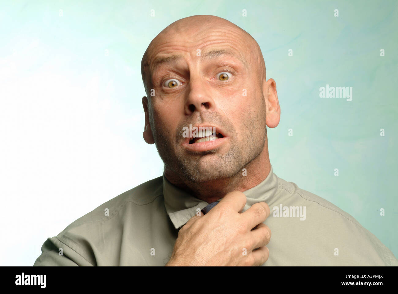 Man with a scared look on his face Stock Photo