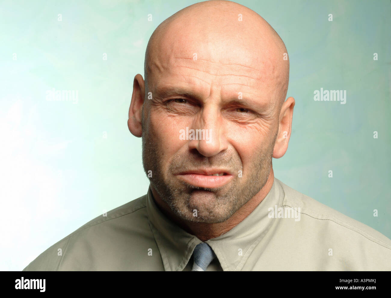 Man with a reluctant look on his face Stock Photo