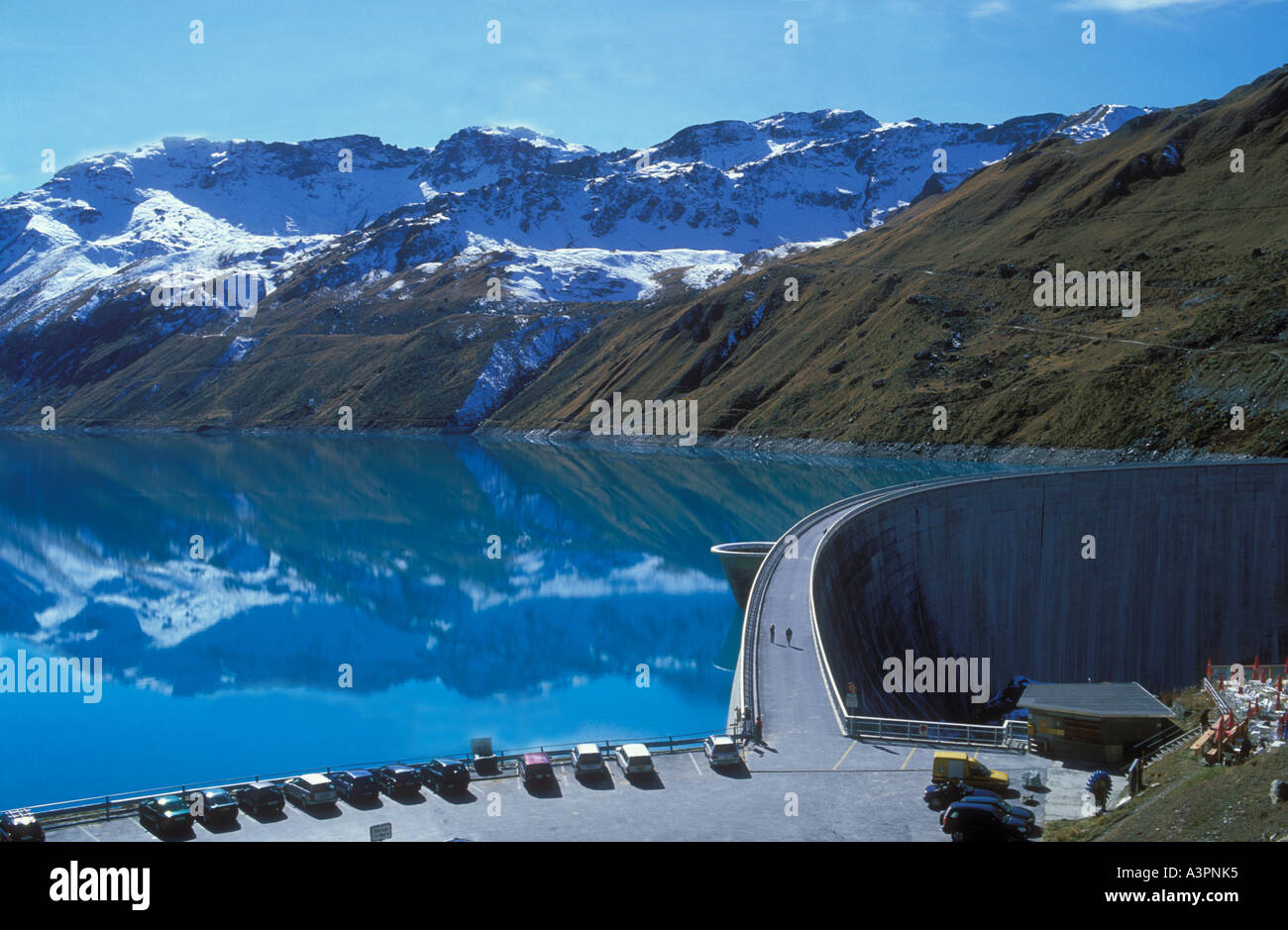 Concrete curved wall to dam Lake Moiry for hydroelecteric power production Valais or Wallis alps Switzerland Stock Photo