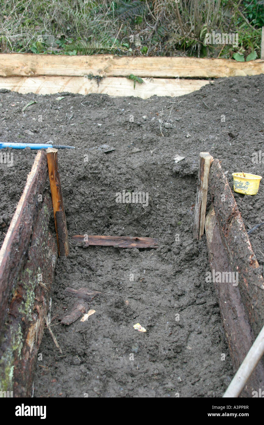 Raised beds digging out the paths ready for the end boards Stock Photo