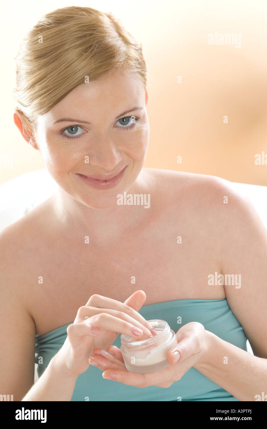 pregnant woman applying cream Stock Photo Alamy