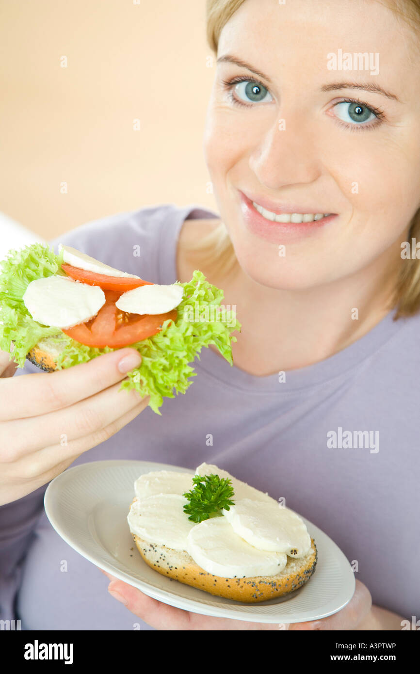 pregnant woman eating sandwiches Stock Photo Alamy