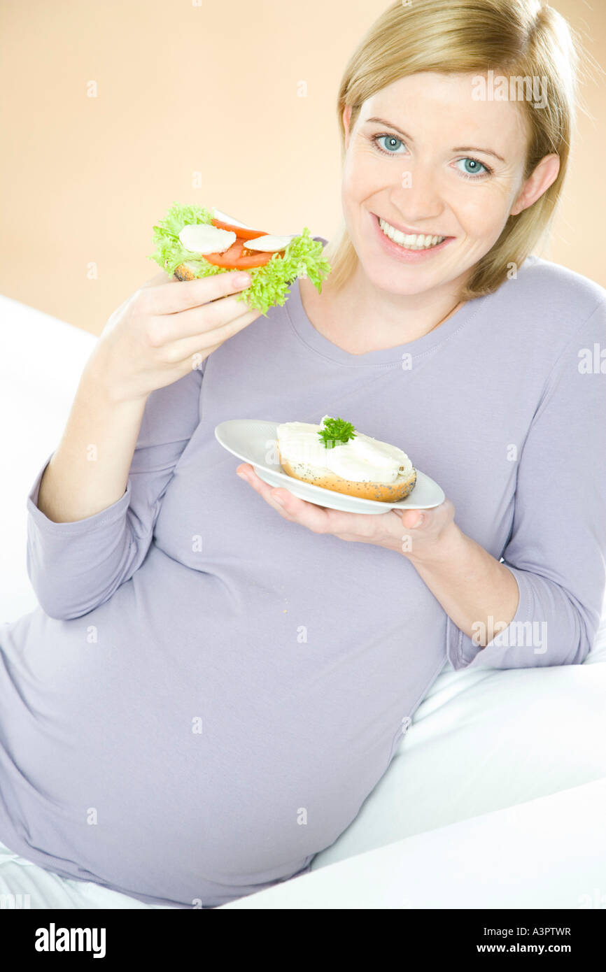 pregnant woman eating sandwiches Stock Photo Alamy