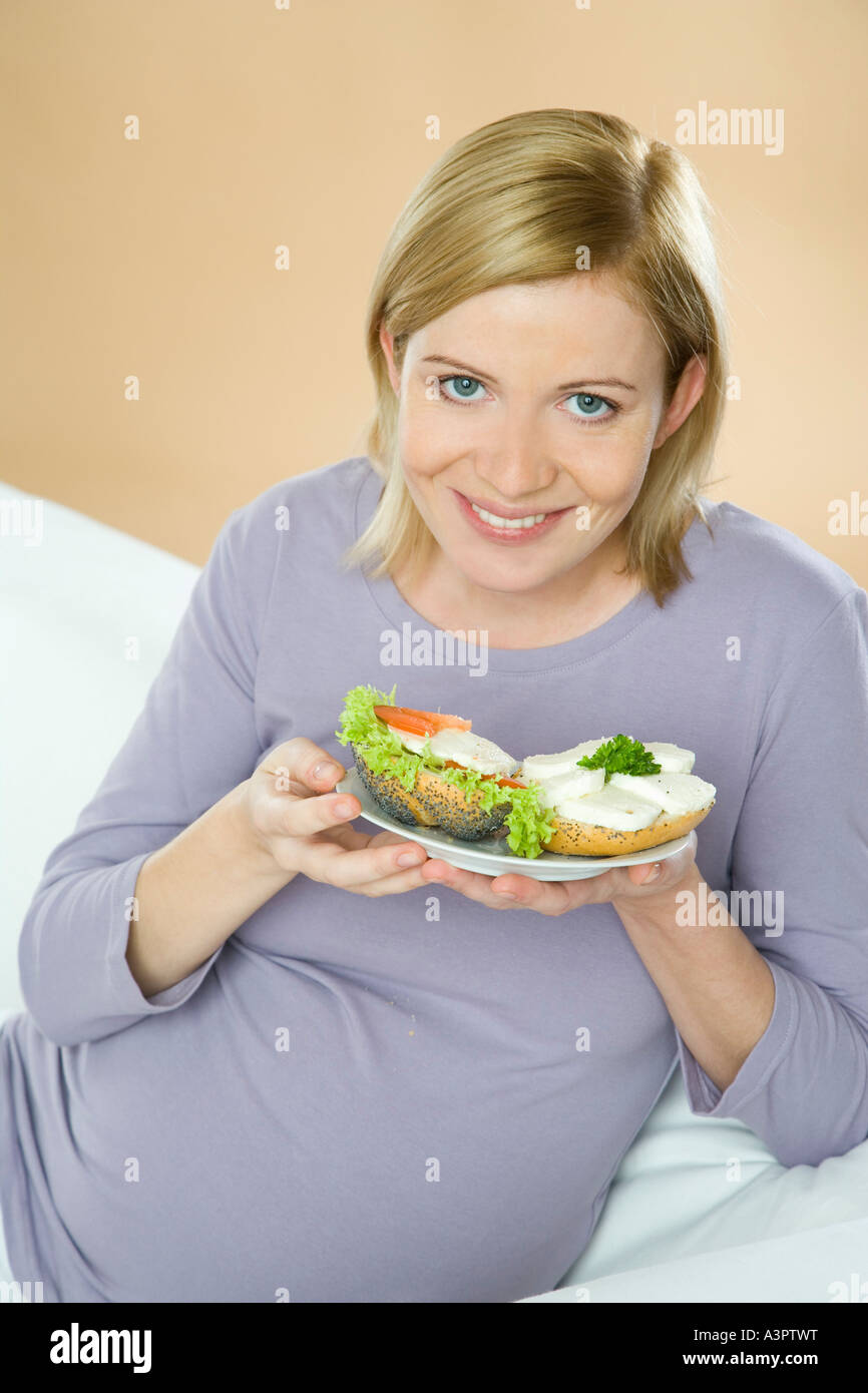 pregnant woman eating sandwiches Stock Photo Alamy