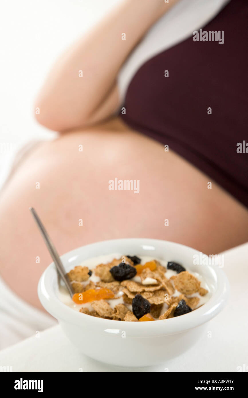 pregnant woman eating muesli Stock Photo Alamy