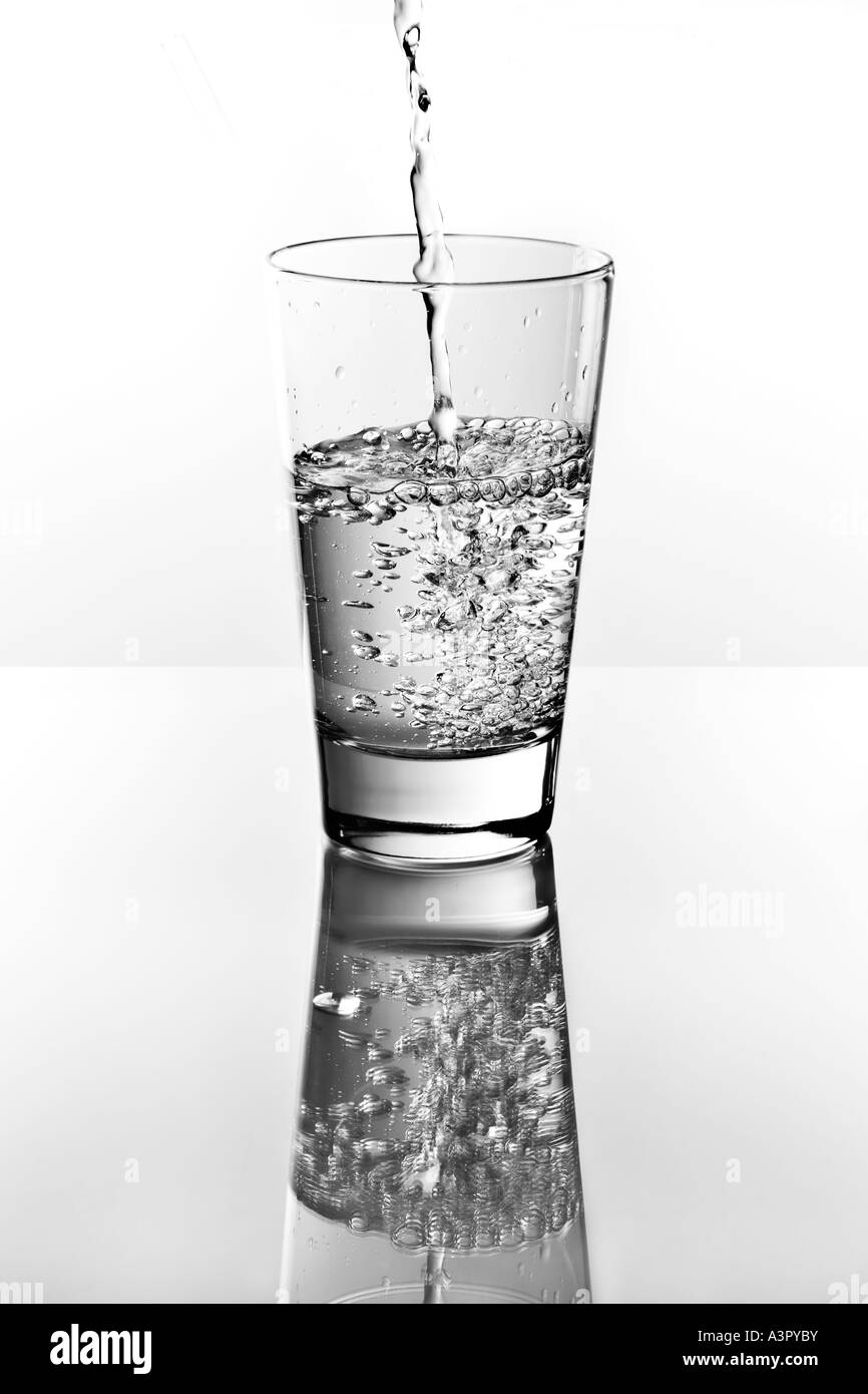 Pouring water into glass Black and White Stock Photos & Images Alamy