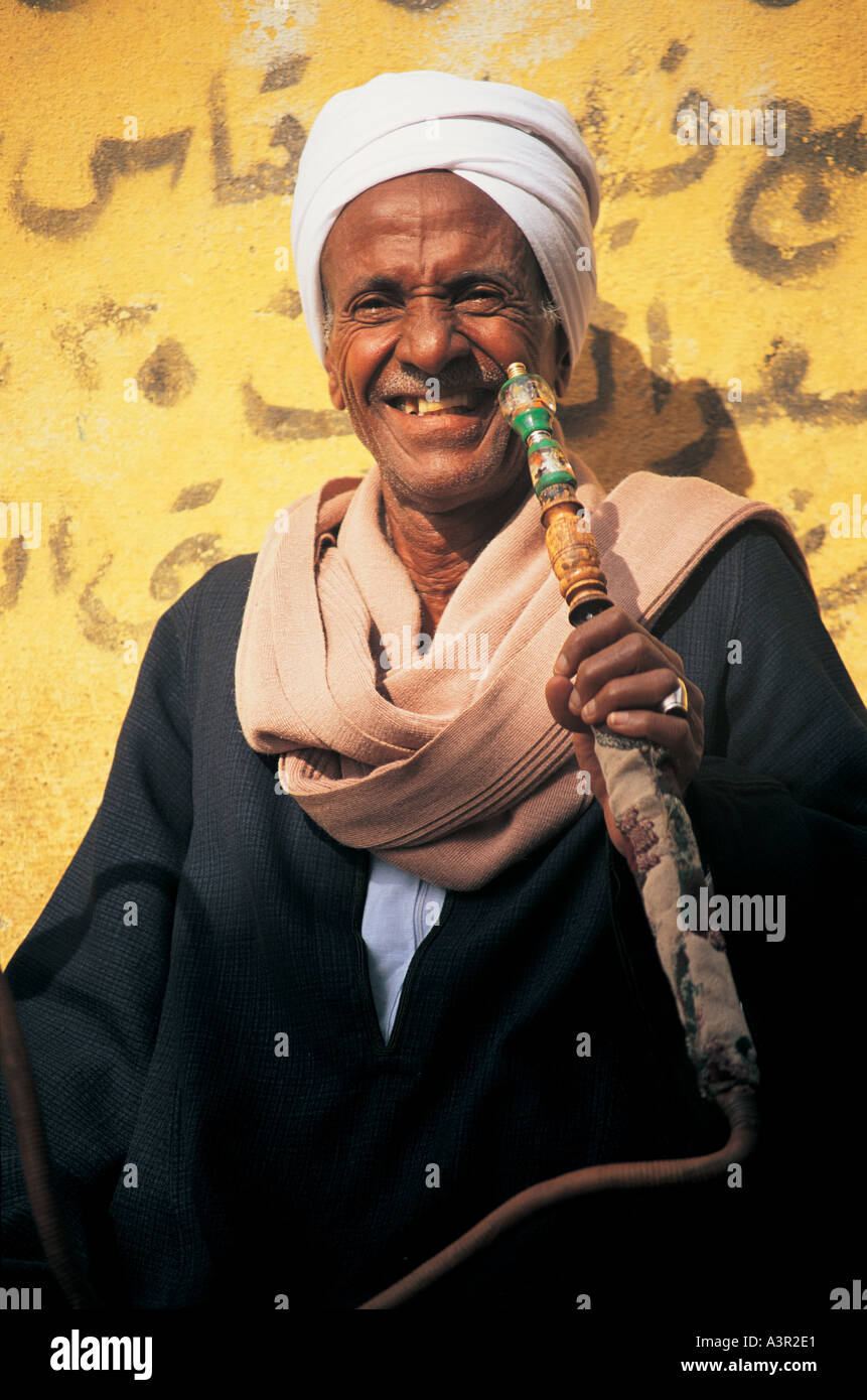 Man smoking hookah pipe in Luxor Egypt Stock Photo