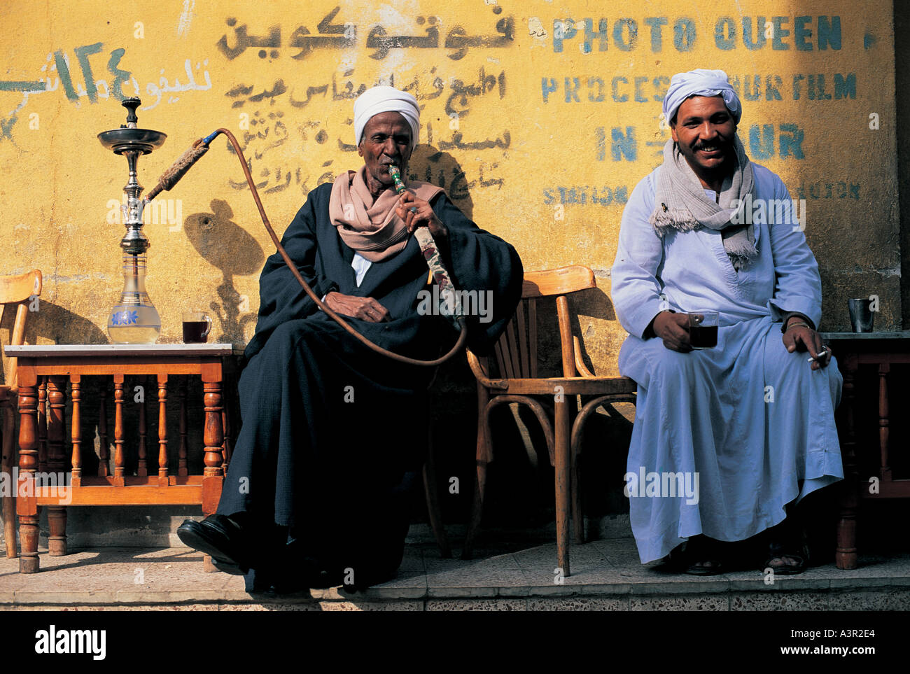 Men smoking hookah pipe in Luxor Egypt Stock Photo