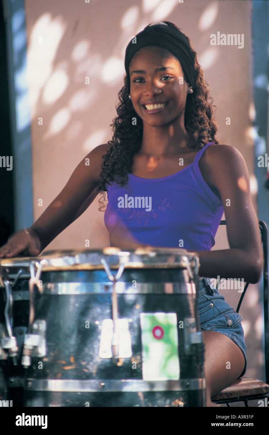 Girl playing drums in Santiago Cuba Stock Photo