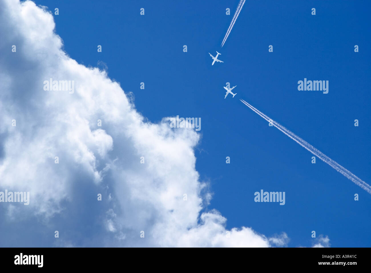 passenger jets in blue sky Stock Photo Alamy