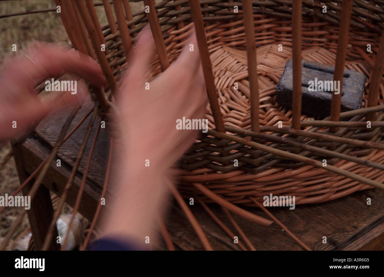 Traditional willow basket weaver at work Stock Photo Alamy