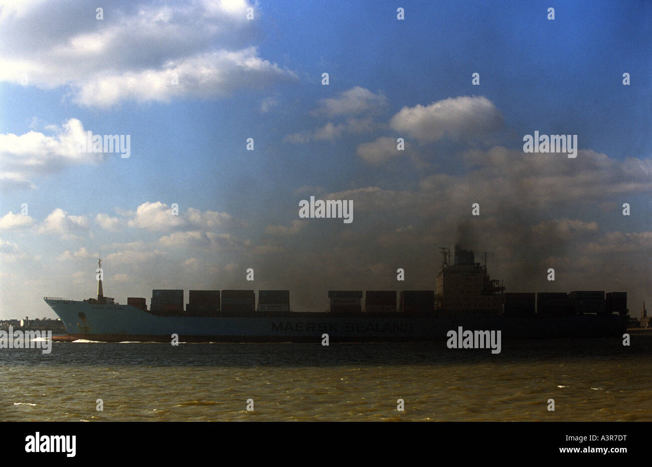 Sulphur dioxide emissions from the engines of a container ship leaving the port of Felixstowe in Suffolk, UK. Stock Photo