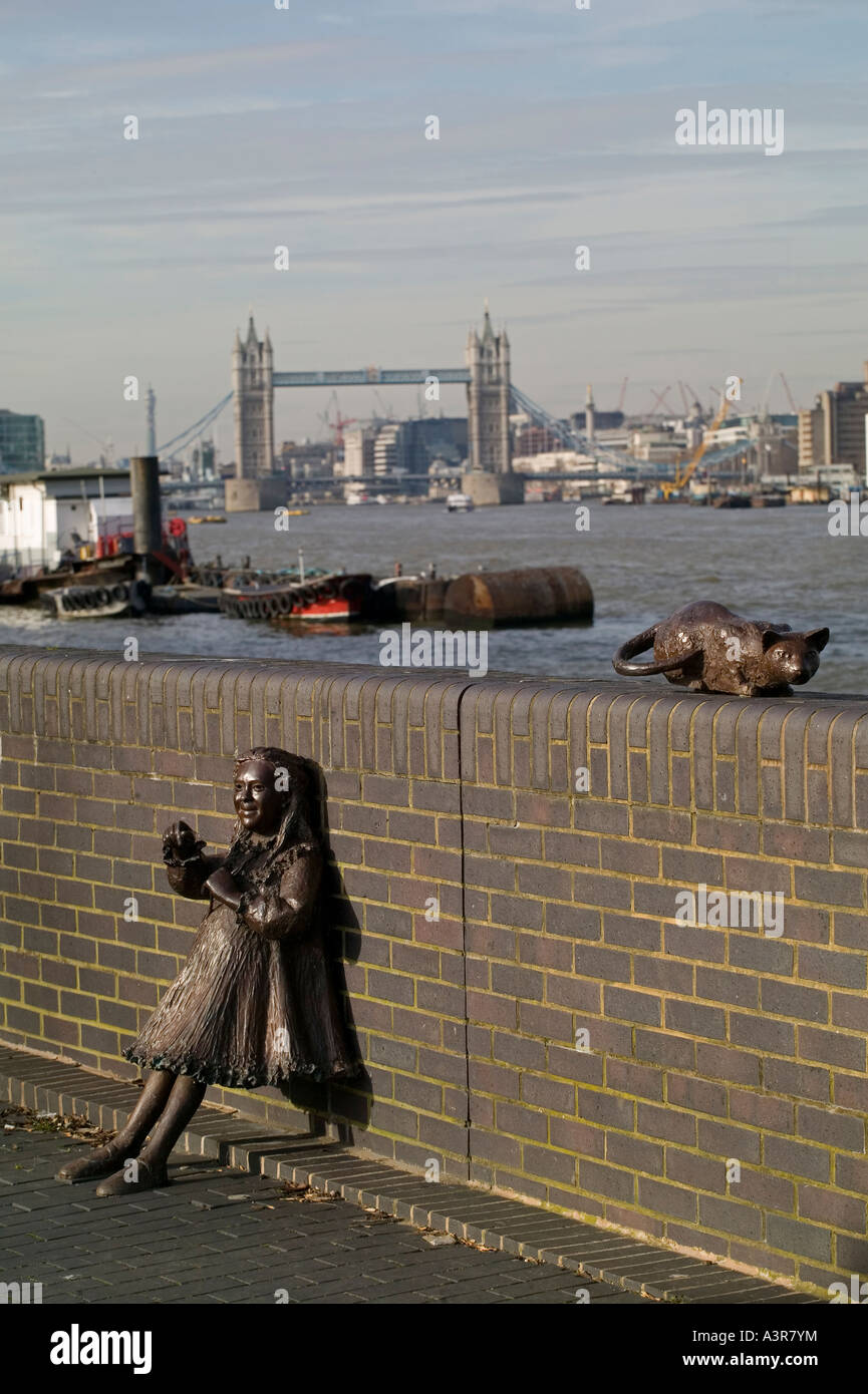 sculptuire of a cat and a chils, girl, on the south bank of the river thames in bermondsey london england Stock Photo