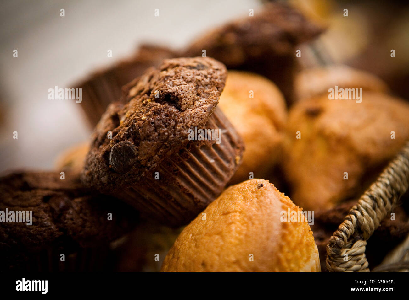 Fresh chocolate chip muffins in a basket on a cake stall in London Borough market Stock Photo