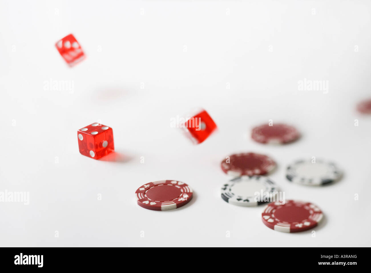 rolling dice and poker chips Stock Photo Alamy
