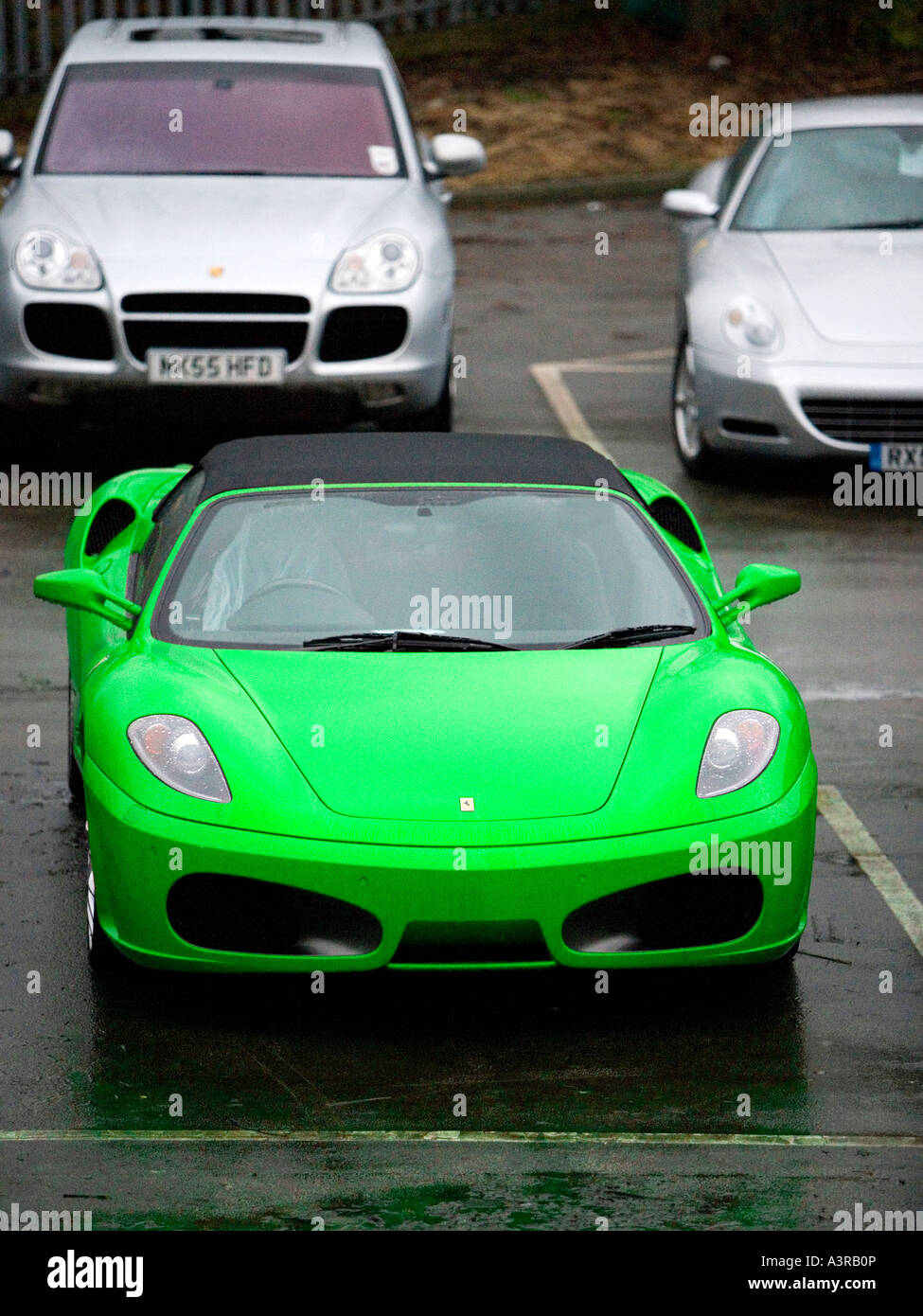 Ferrari F430 360 Modena Lime Green parked in rainy garage