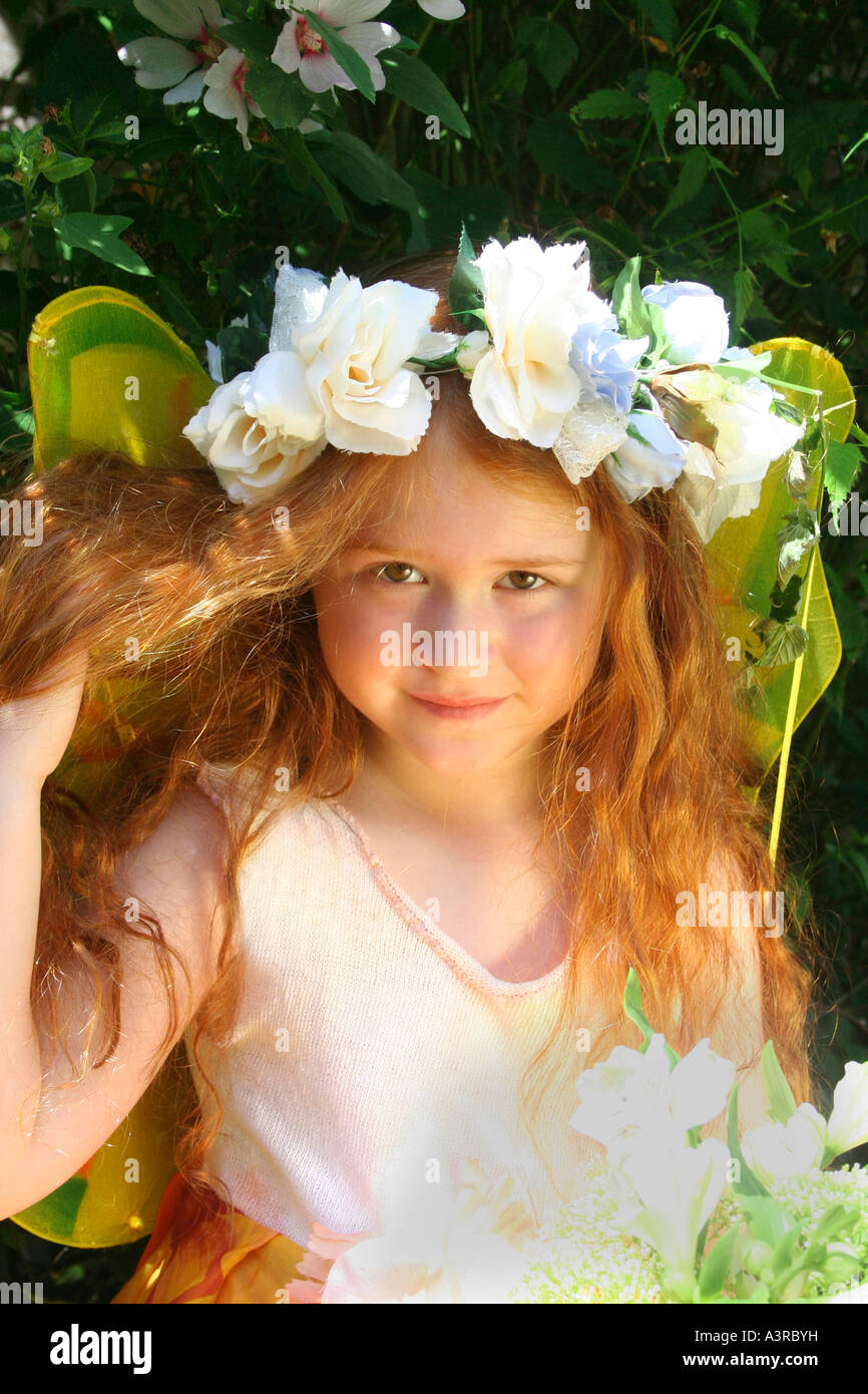 Child wearing a crown of flowers Stock Photo