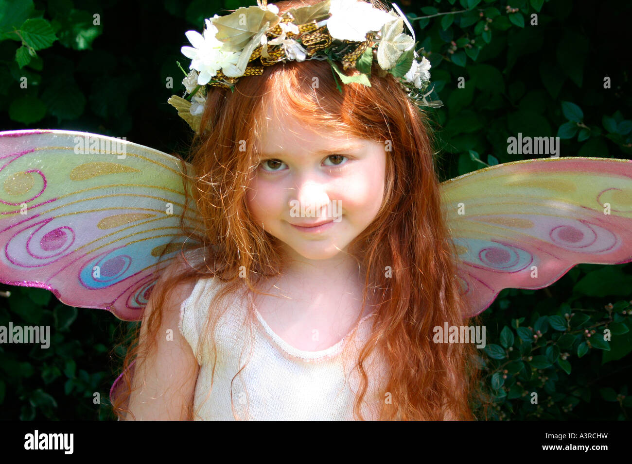 red-haired little angel with wings Stock Photo