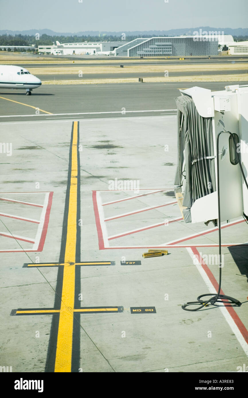 Commercial airliner pulling into gate at Portland International Airport ...