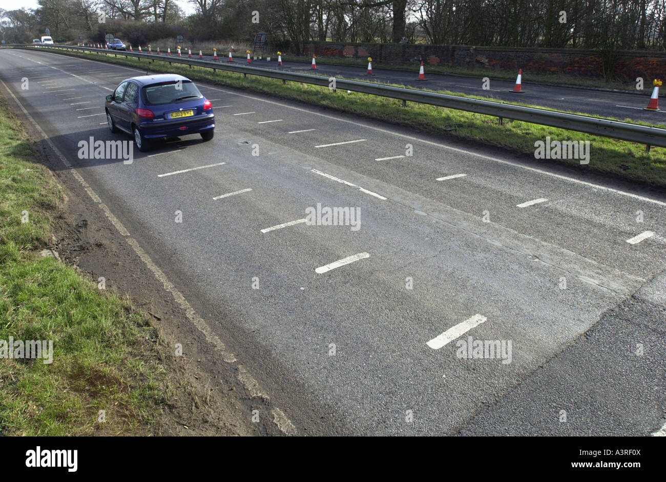 Lines on a dual carriageway that help measure the speed a car is driving at. UK Stock Photo