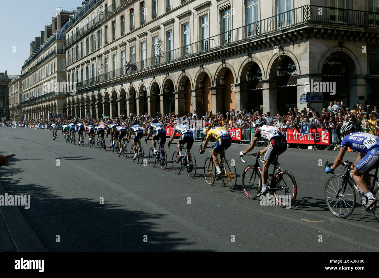 Tour de France leader Lance Armstrong in yellow jersey rides up the rue de Rivoli in Paris France with his US Postal teammates Stock Photo