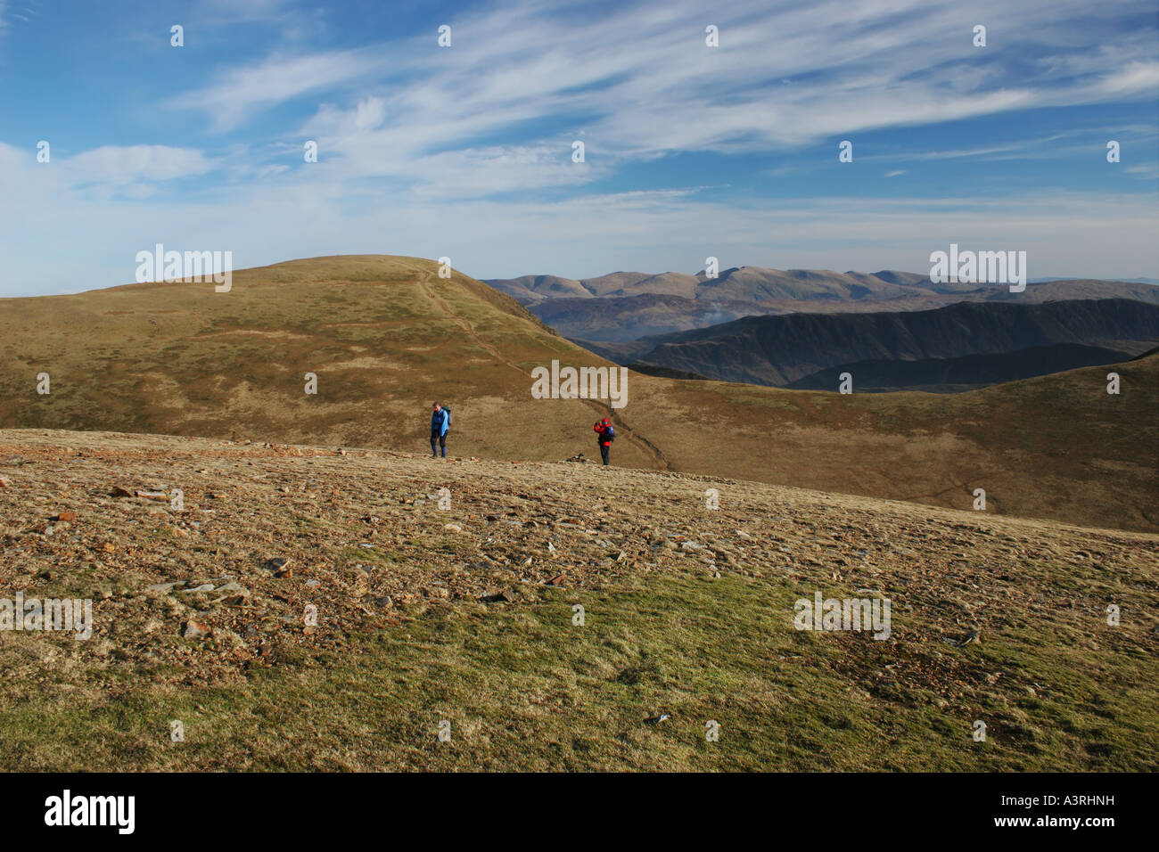 Hill Walkers Climbing Grasmoor From Coledale Hause with Sand Hill Behind Lake District Cumbria UK Stock Photo