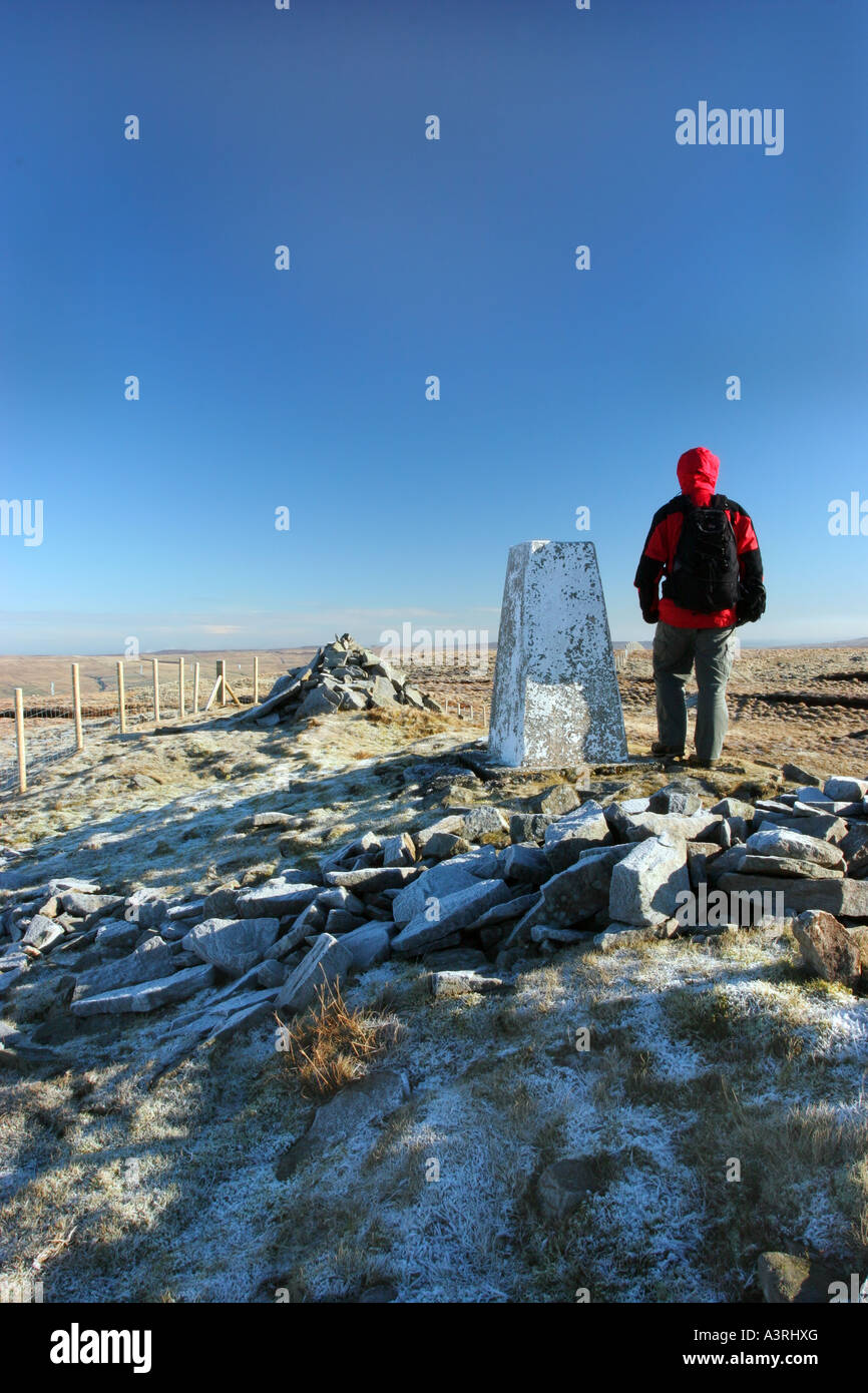 Hill Walker and Summit Trig Point on Great Stony Hill Coldberry End Upper Teesdale County Durham Stock Photo