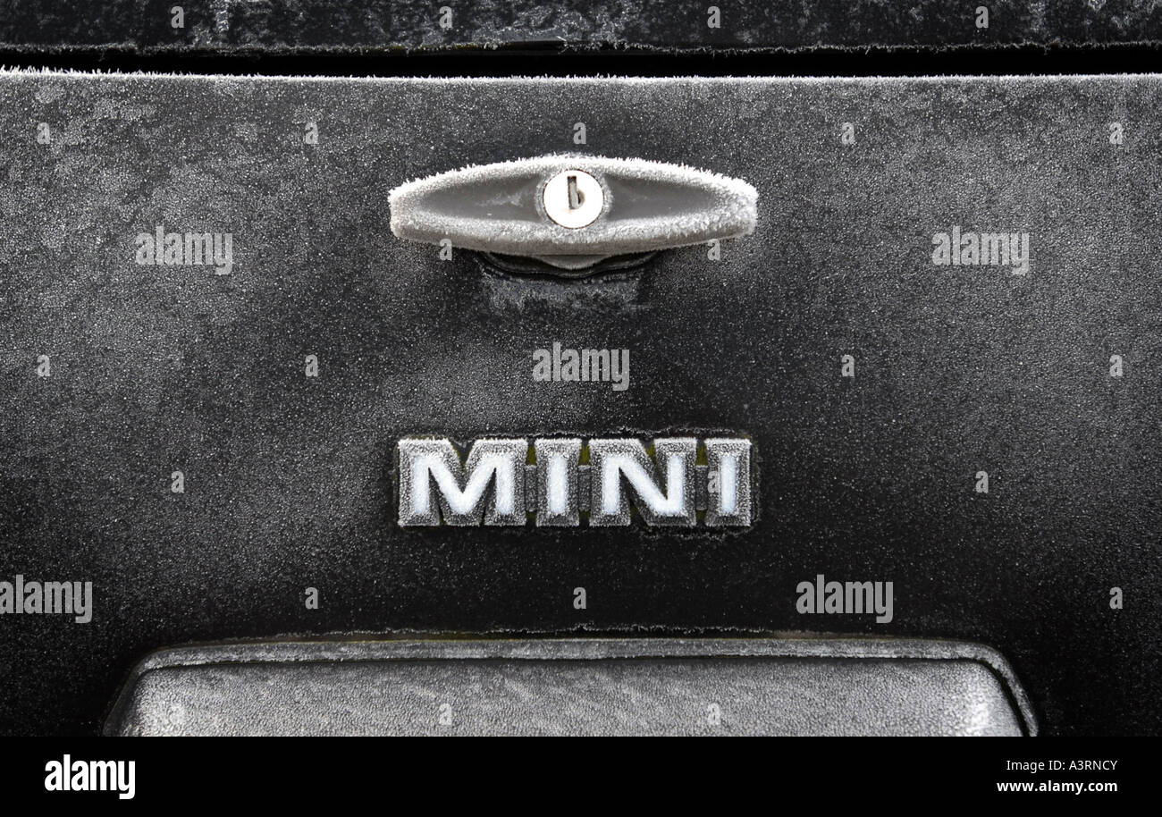 A CLASSIC ROVER MINI CAR SHOWING FROSTY MINI LOGO AND BOOT HANDLE UK Stock Photo