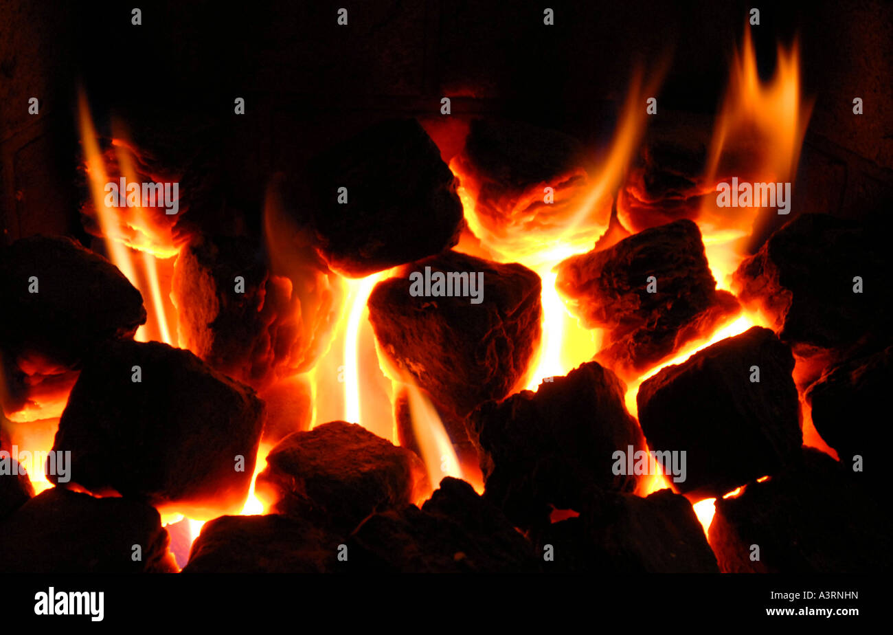BURNING HOT  COALS IN DOMESTIC FIREPLACE.UK Stock Photo