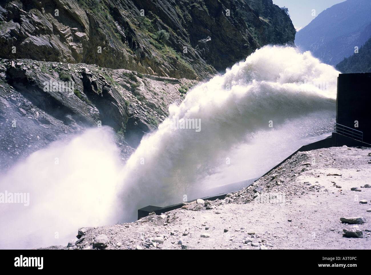 Water spouts from outlet pipe from a new hydro-electric generating station in Sangla Valley, HP India Stock Photo