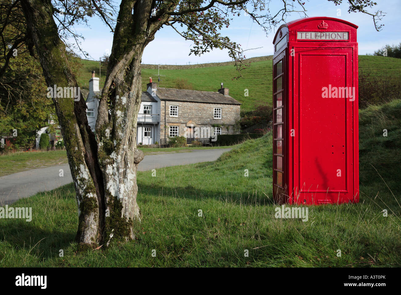 Traditional Red Telephone Box in the rural hamlet of Howgill Cumbria England Stock Photo
