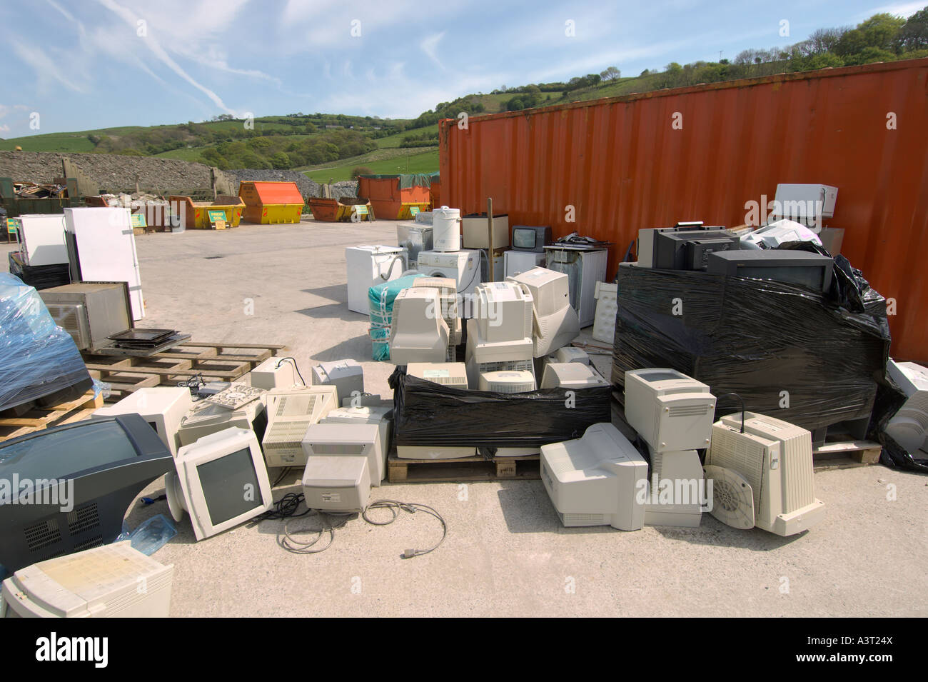 Discarded scrapped computers and other electrical consumer goods awaiting recycling at Aberystwyth ceredigion Wales UK Stock Photo