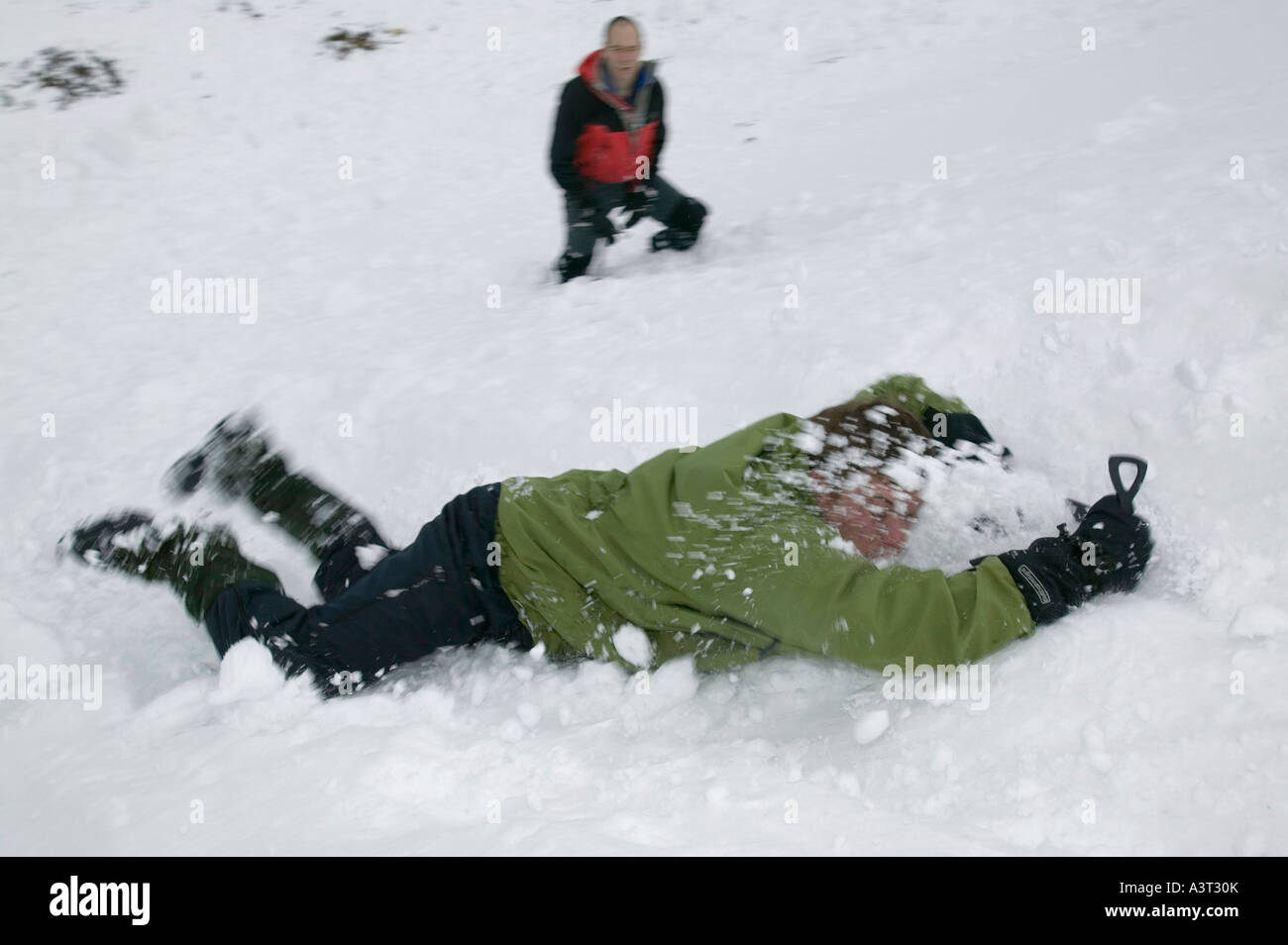 mountain rescue team members practice ice axe arrests in the Cairngorm