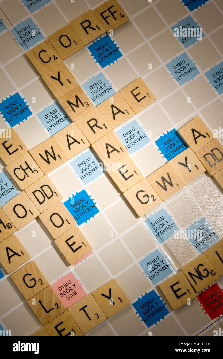 WELSH language version of scrabble word board game showing double letter tiles Stock Photo