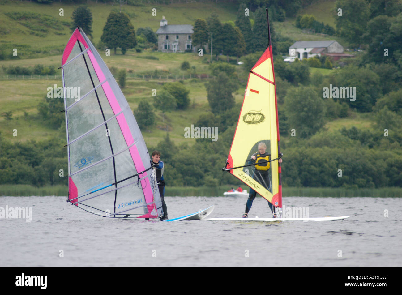 two windsurfers on Bala Lake [llyn tegid] gwynedd north wales on a grey