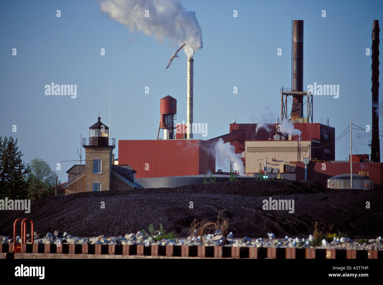 THE ONTONAGON LIGHTHOUSE AND SMURFIT STONE PLANT IN ONTONAGON MICHIGAN