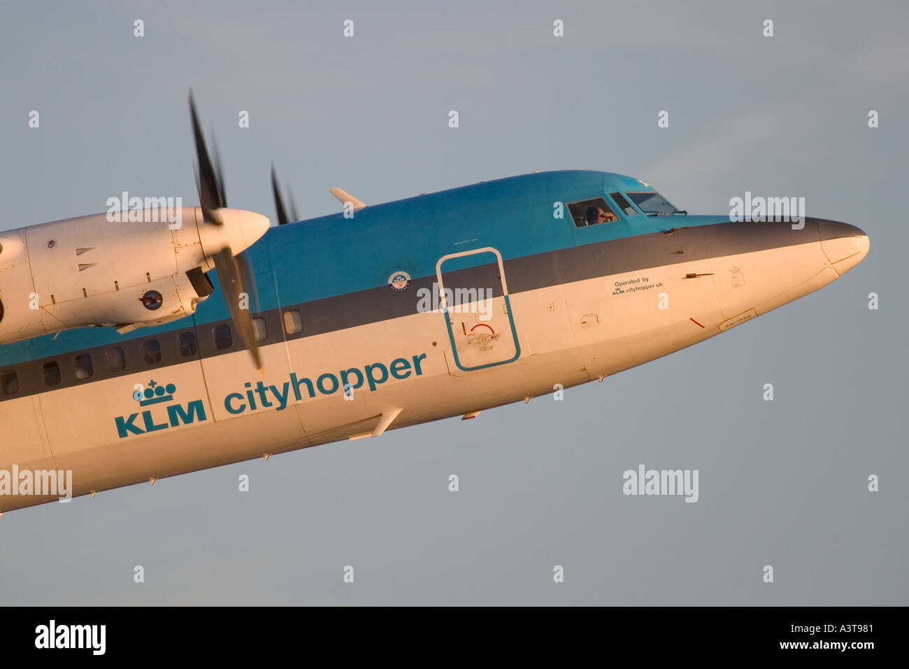 Commercial aircraft Fokker 50 KLM taking off at London City Airport, England, UK Stock Photo