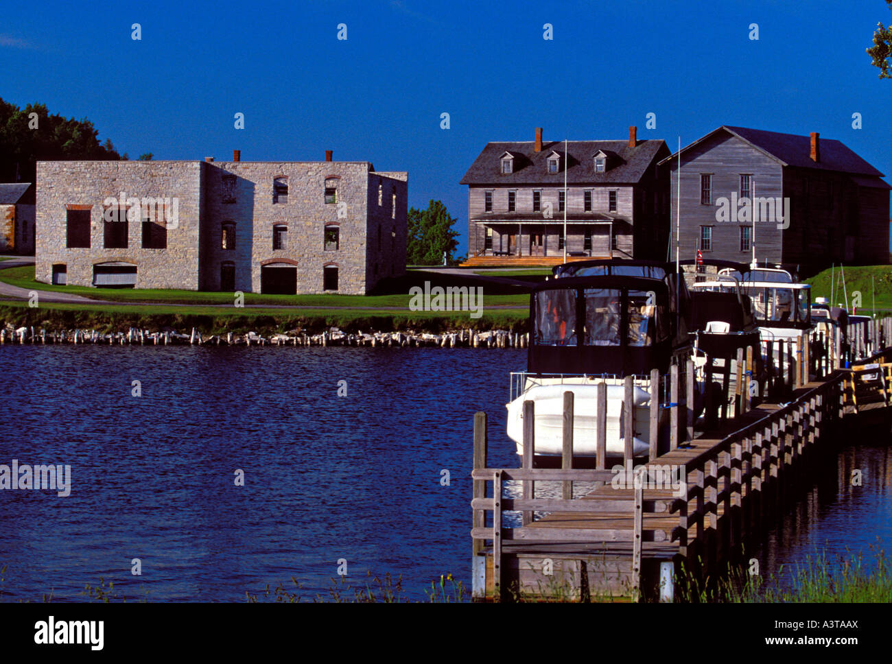 BOATS DOCK IN SNAIL SHELL HARBOR NEAR NINETEENTH CENTURY BUILDINGS AT FAYETTE STATE HISTORIC PARK ON THE GARDEN PENINSULA Stock Photo